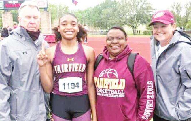 Shadasia Brackens wins the gold medal in high jump at Regionals to advance to State. She is pictured with Coach Randy Barger, Coach Tarsha Graves, and Coach Sally Whitaker.