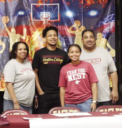 Pierre Algood signs his letter of intent to play basketball with Hesston College in Hesston, Kansas on Tuesday, April 30. Pictured are Trishana Algood, Pierre Algood, Paris Algood, and David Algood. Courtesy Photo