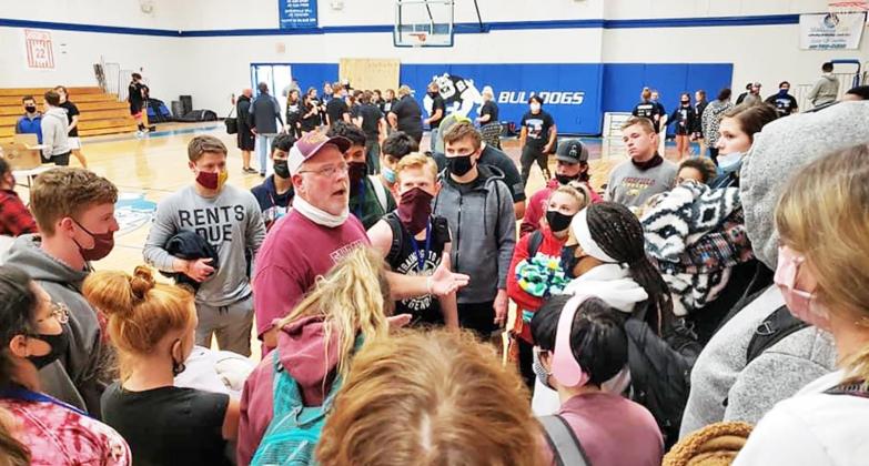 Coach Kevin Childers talks with his powerlifters on Saturday during the powerlifting meet in Bosqueville. Contributed Photo by FHS News