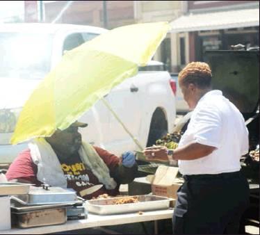 RIGHT: Freestone County Constable from Precinct 3, Pamela L. Barnes, checks the grill during a meet and greet lunch July 22. Photos by Thomas Leffler/ Fairfield Recorder