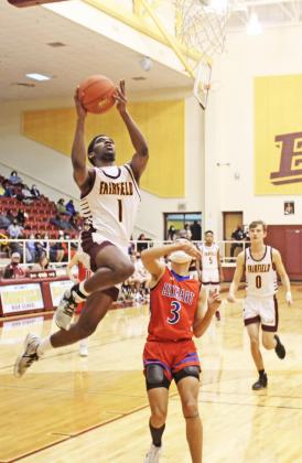 Junior Kamren Griffin goes up to score a basket for the Eagles. Photo by Mitchell Pate