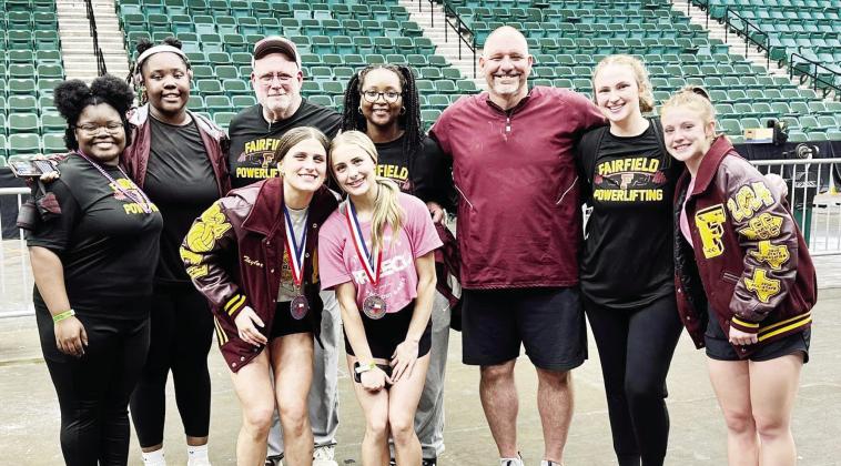 Five Lady Eagles competed at the State Powerlifting Meet in Frisco on Thursday, March 14. Pictured are (front) Taylor Stone, Riley Stone, (back) Callie Morgan, Destiny Dowell, Coach Kevin Childers, Manager Cinayh Wylie, Coach John Bachtel, Coach McKenzie Harris, and Emma Jo Smith. Courtesy Photo