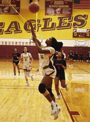 LEFT: Jacelynn Schmidt scored a basket for the Lady Eagles. CENTER: Jalecia McMillian shoots a basket for Fairfield against the Lady Blackcats. RIGHT: Charlee Brackens scores a basket for the Lady Eagles against Mexia. Photos by Mitchell Pate/Fairfield Recorder