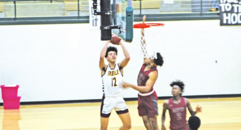 Kobe Freeman (#12) averaged 17 points and 12 rebounds a contest for the Eagles basketball squad in the 2019-20 season. Photo by Thomas Leffler
