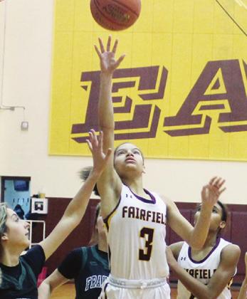 TOP: Jarahle Daniels goes up for a basket for the Lady Eagles against Franklin.