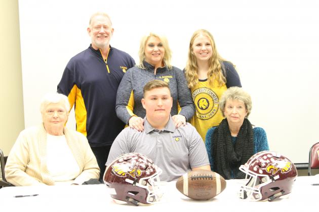 Noble's family watches on as the Offensive Lineman signs with Texas A&M University-Commerce.