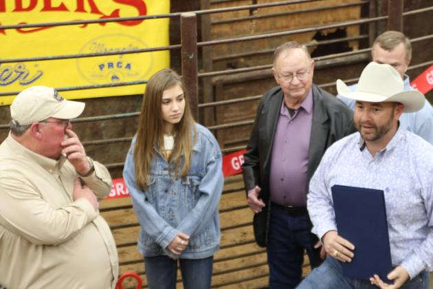 State Representative Cody Harris (right) congratulates Dr. James Peters and his staff on the Grand Opening of the Anderson County Livestock Exchange