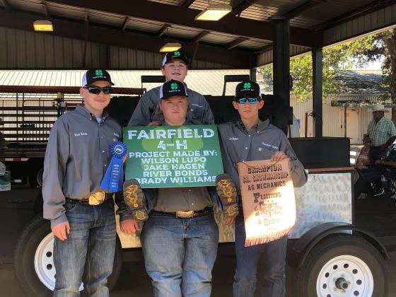 River Bonds, Brady Williams, Jake Hughes and Wilson Lupo were awarded first place in Senior Showmanship at the Ag Mechanics Show. Photo contributed by Kayla Lupo. 