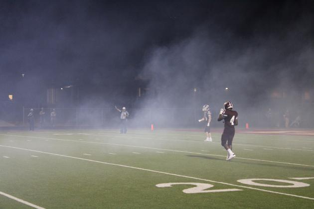 The Eagles prepare to receive the second-half kickoff amid the remnants of the team's fog-filled entrance.