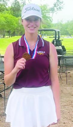 Fairfield senior Allie Hughes shows off her medal. She finished third at region and qualified for the state golf tournament.