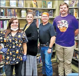 The Fairfield Library crew flipped into their Halloween costumes this past week. Friends of the Fairfield Library will have two fundraisers throughout November. Pictured from left to right are: Jessica Jones, Lela Erwin, Gary Wiggins, and Eli Pratt from Incommons Bank.