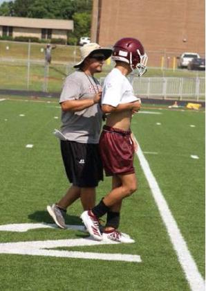 Fairfield High School football trainer Kris Ballew attends to one of his varsity players during a August 6 practice session. Photo by Mary Cryer Awalt/The Fairfield Recorder