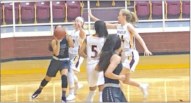 The Fairfield Lady Eagles have gotten off to a 5-0 start, capped by back-to-back wins over Waco schools on Nov. 25 and 26. Defense has been the name of the game for #22 Belle Johnson, #5 Kayelee Adams and #34 Braden Bossier, who put pressure on a University rim run during the Tuesday contest. Photo by Thomas Leffler