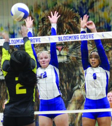 Wortham players Riley Winstead (12) and Dakota Butler (9) set up a block during the Lady Bulldogs’ 3-0 victory against Itasca Monday evening at Blooming Grove High School. Photo by Jason Chlapek/Fairfield Recorder