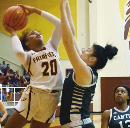 ABOVE: Shadasia Brackens goes up for a basket against Canton.