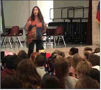 California-based children’s author Marsha Diane Arnold presnts her books, including “The Pumpkin Runner” and “Galapagos Girl,” to second-grade students at Fairfield Elementary last Thursday. Photo by Thomas Leffler
