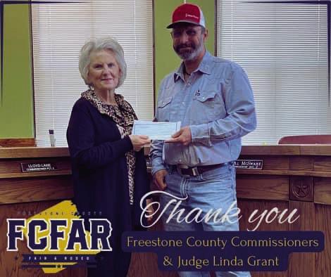 Judge Linda Grant and the Freestone County Commissioners donate $15,000 to the Freestone County Fair and Rodeo Association for the upcoming fair to be held June 10-15. Pictured is Judge Linda Grant presenting the check to FCFAR President Jody Bodine. Courtesy Photo