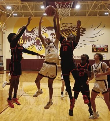 J’Dyen Canady goes up for a rebound for the Eagles against Westwood. Photo by Mitchell Pate/Fairfield Recorder