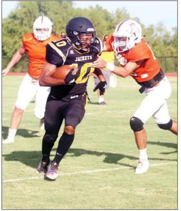 Coolidge running back T.J. Hoover gains yardage in a scrimmage earlier this season. The senior scored both touchdowns for the Yellowjackets in a loss to Wautaga Harvest Christian on Friday. File photo by Skip Leon/The Mexia News