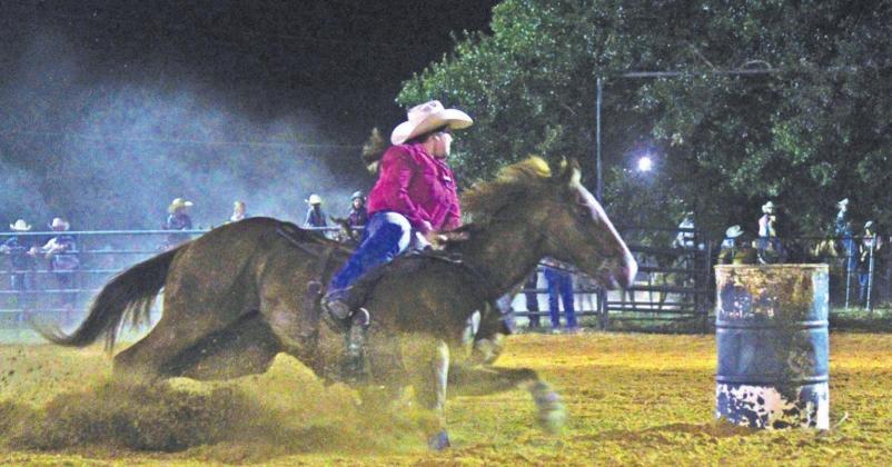 Rheagan Cotton of Fairfield whips around a barrel during the Youth Rodeo in memory of Yates Manahan. Photo by Mitchell Pate