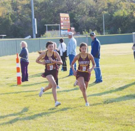 Teammates Lillian McBean and Arly Salazar finished together Saturday. Photo by Thomas Leffler