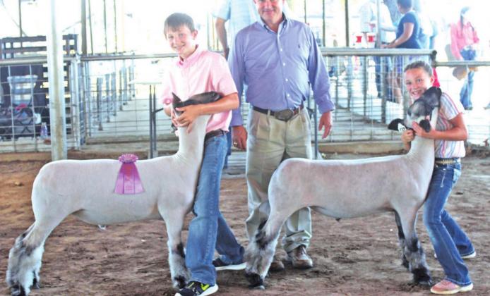 Siblings Cole (left) and Kenna (right) Coufal were successful at the 2020 Freestone County Livestock Show, including junior showmanship awards for their lamb projects. Photo by Mitchell Pate