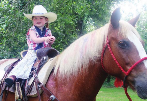 Macey Glick, the daughter of Jacob and Haley Glick, was named the Best Dressed Cowgirl at the Back in the Saddle Again Parade for the 2021 Freestone County Fair.