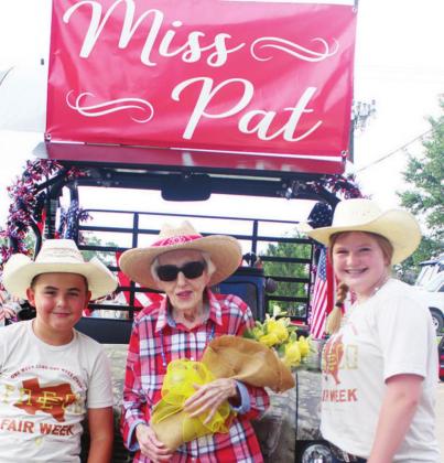 Miss Pat Robertson served as the Grand Marshall of the Back in the Saddle Again Parade for the 2021 Freestone County Fair on Monday night. She is pictured with Logan Williams and Rainy Bonds.