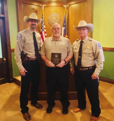 Freestone County Sheriff Jeremy Shipley and Chief Deputy Devin Mowrey honor Deputy John Steele as the FCSO Deputy of the Year. Courtesy Photo