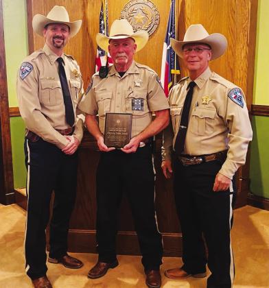 Freestone County Sheriff Jeremy Shipley and Chief Deputy Devin Mowrey honor Officer David Filis as the FCSO Employee of the Year. Courtesy Photo