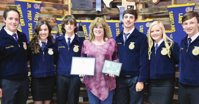 Dena McQuinn was inducted into the Fairfield FFA as an honorary member at the annual FFA banquet. Pictured are Connor Petty, Ally Robinson, Ryan MacMillan, Dena McQuinn, Kade Bailey, MaKenna Eppes, and Cole Coufal. Photos by Mitchell Pate/ Fairfield Recorder