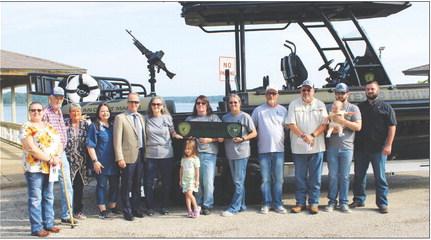 The family of Trooper Damon Allen poses in front of the Tactical Marine Unit that bears his name Tuesday morning at Fairfield Lake State Park. Allen lost his life in the line of duty on Nov. 23, 2017. Photo by Jason Chlapek/Fairfield Recorder