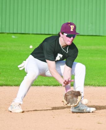 Senior Cameron Cockerell scoops up the ball for the Eagles at shortstop during practice. Photo by Mitchell Pate/Fairfield Recorder