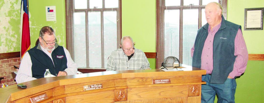 Freestone County Justice of the Peace No. 2 James Lawrence, at right, speaks to the Commissioners Court at its Dec. 18 meeting about the need for full-time clerks for both JP 2 and JP 4 offices. Continuing left can be seen Precinct 1 Commissioner Andy Bonner and Precinct 2 Commissioner Will McSwane. Photo by Roxanne Thompson/Fairfield Recorder