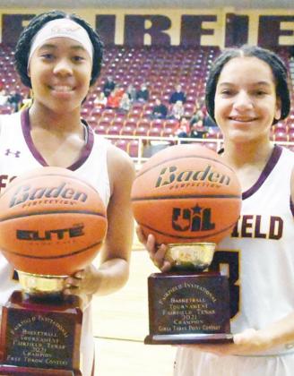 Breyunna Dowell and Jarahle Daniels show off their trophies they won at the Fairfield Tournament. Dowell won the free throw contest and Daniels won the three-point contests. Photo by Mitchell Pate/ Fairfield Recorder