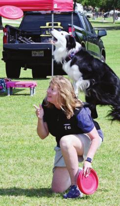 ABOVE, LEFT: Tammy Montgomery and her pup, Hondo, compete in the freestyle competition of the Disc Dog Texas State Championship on Sunday.