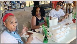 Enjoying the good food and fellowship at the anniversary events were, from left, Marion Brown, Evelyn Lawson and Alani Jones. Contributed photo