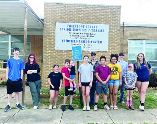The Fairfield 4-H Club cleaned flower beds and planted flowers and veggies at the Senior Center in Fairfield on Sunday, March 3. Richland Chambers Landscape and Irrigation owned by Darcy and Robert Stutts donated the raised flower beds and all of the plants. Courtesy Photo