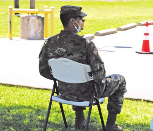 A member of the Texas National Guard “Alpha Group” oversees the mobile testing site held at Freestone Medical Center. Photo by Mary Cryer Awalt