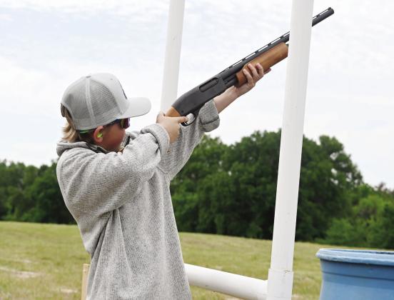 LEFT: Beau Johnson shoots in the competition on Saturday, April 6, at the Kindness From Case Range. RIGHT: Cooper Hayes is the Youth Champion at the 4th Annual Kindness From Case Sporting Clays Shoot. Photos by Mitchell Pate