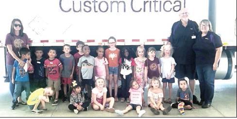 Mrs. Beaver’s Kindergarten class at Fairfield Elementary School was given a special visit from Rodney and Mary Dodd (right) from the Trucker Buddy International organization. Students were given a lift up into the truck and learned about what it takes to be a trucker. Photo by Thomas Leffler/The Fairfield Recorder
